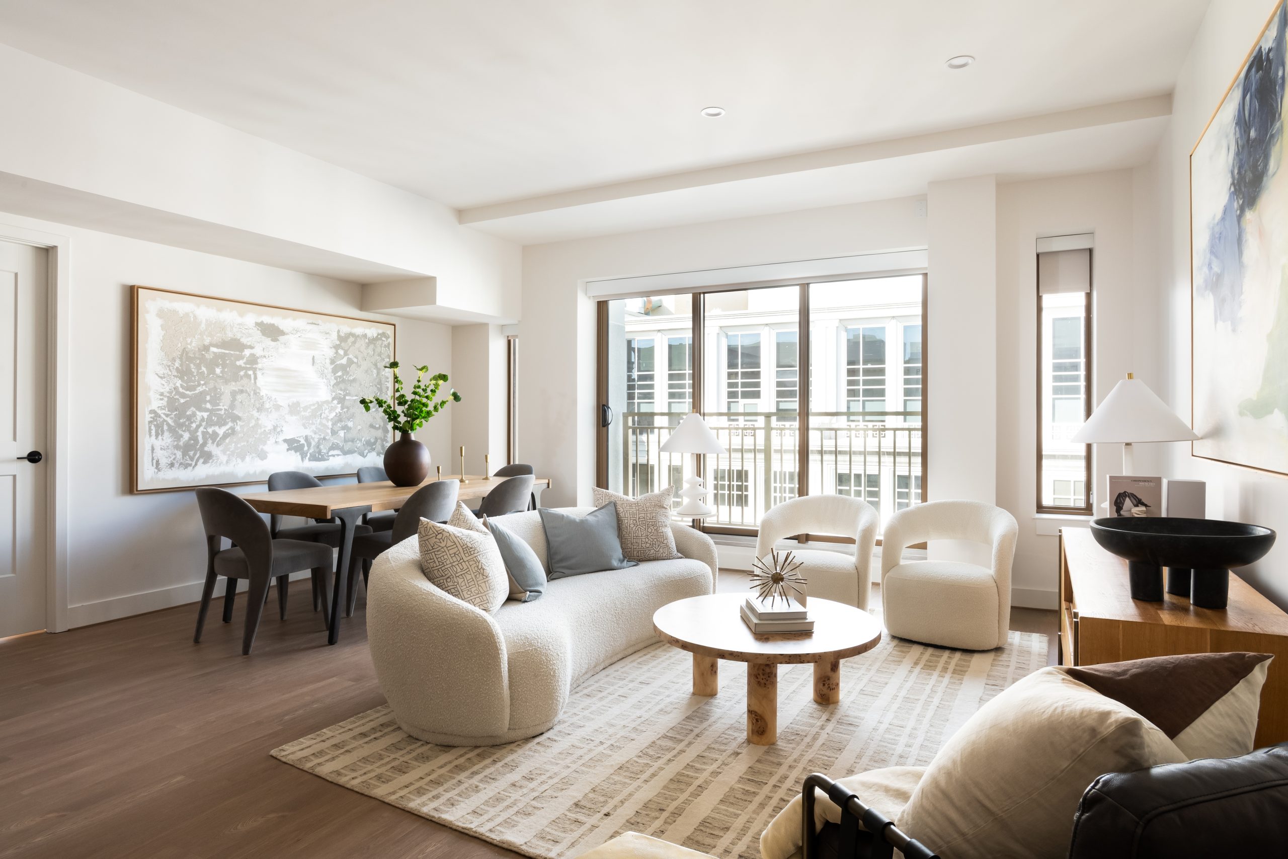 Accolade penthouse living space with expansive windows and open layout built for living and dining.
